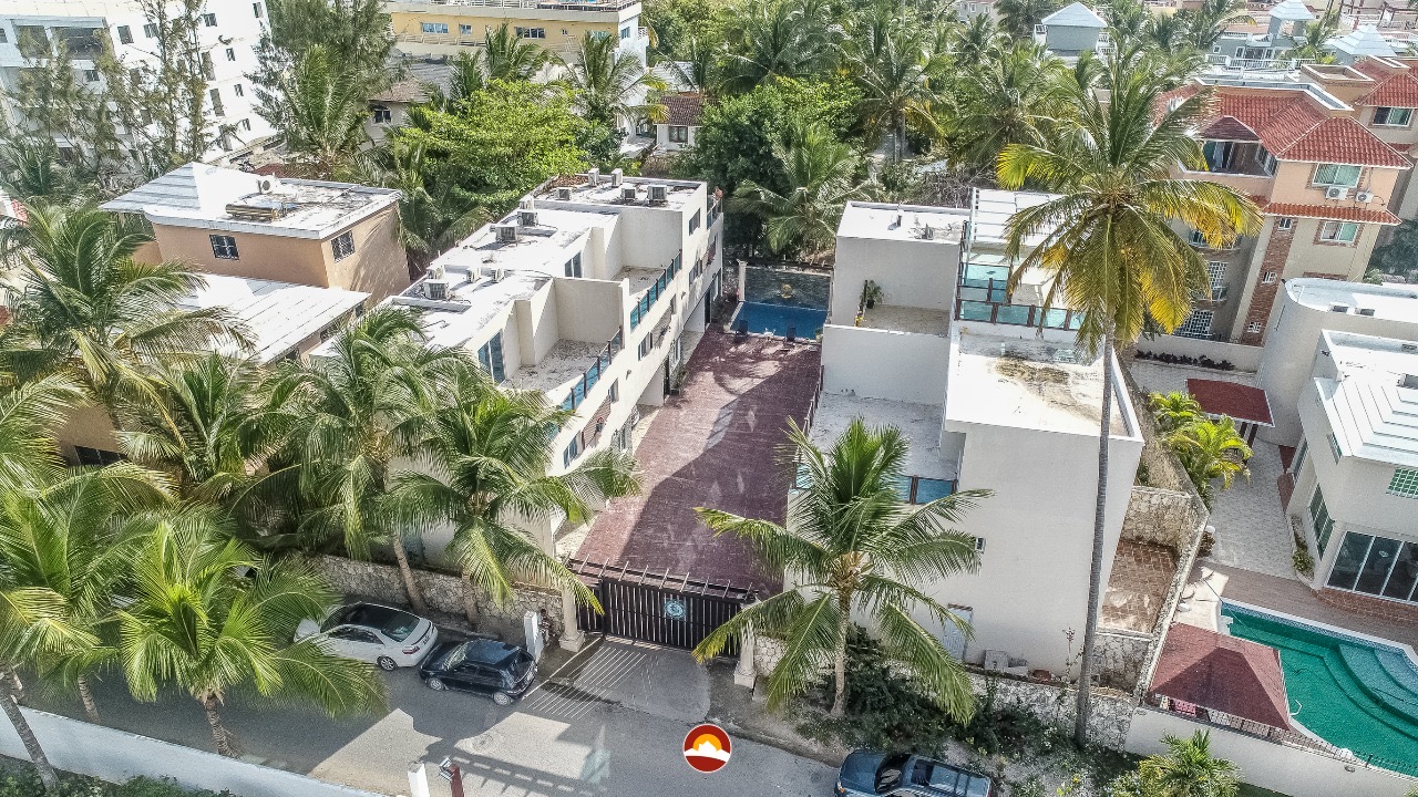 Aerial street view of gated villa complex for sale in Punta Cana — near Playa Los Corales, Dominican Republic